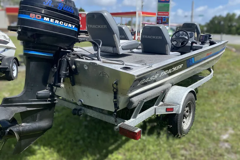 The Image of 1994 Tracker Pro Guide V-17 SC boat with Mercury 80 engine on trailer. - 1