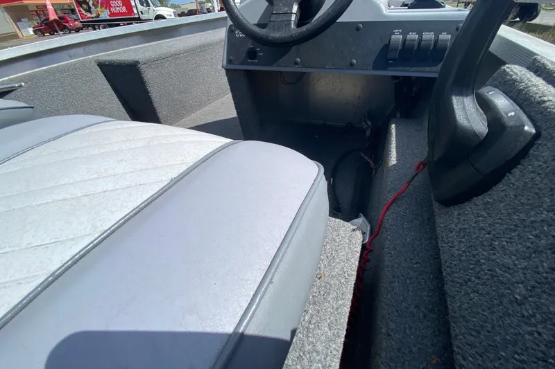 Slide: The Image of Interior of a 1994 Tracker Pro Guide V-17 SC boat, featuring seating and control panel. - 12