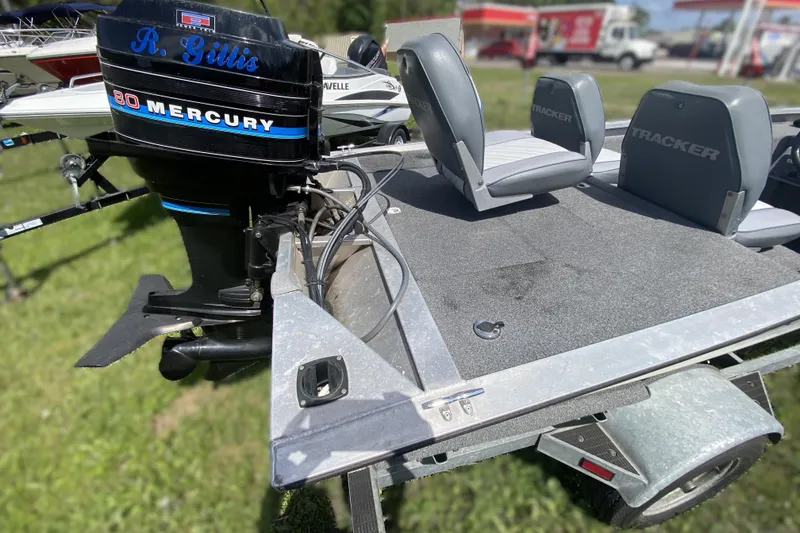 Slide: The Image of 1994 Tracker Pro Guide V-17 SC boat with Mercury 80 engine, gray seating. - 13