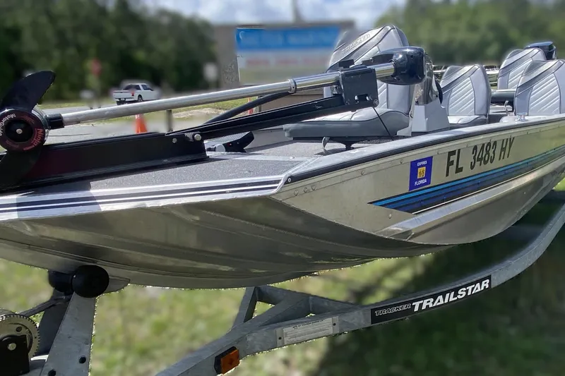 Slide: The Image of 1994 Tracker Pro Guide V-17 SC boat on trailer, Florida registration visible. - 3
