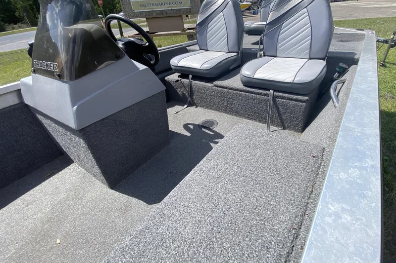 Slide: The Image of 1994 Tracker Pro Guide V-17 SC boat interior with dual seats and steering console. - 9