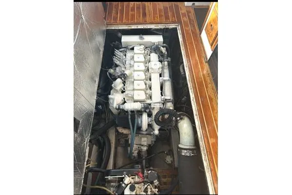Slide: The Image of Engine compartment of a 1998 Eastern 35 Casco Bay boat with wooden flooring. - 14