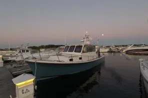 Slide: The Image of 1998 Eastern 35 Casco Bay boat docked at sunset in a marina. - 3