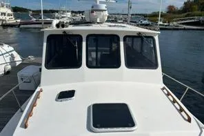 Slide: The Image of 1998 Eastern 35 Casco Bay boat docked at a marina. - 5