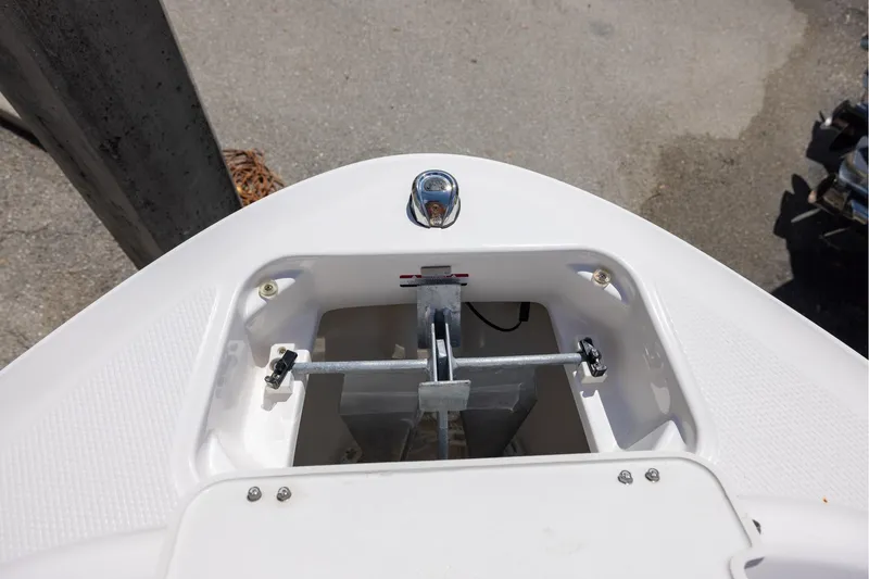 Slide: The Image of Bow anchor compartment of 2021 Chaparral 21 SSi OB boat, featuring stainless steel fittings. - 11