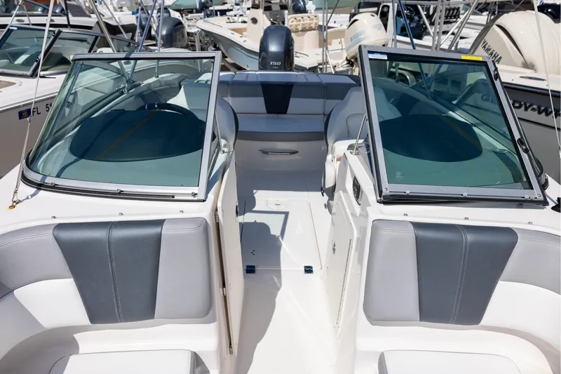 Slide: The Image of 2021 Chaparral 21 SSi OB boat interior with seating and windshield. - 12