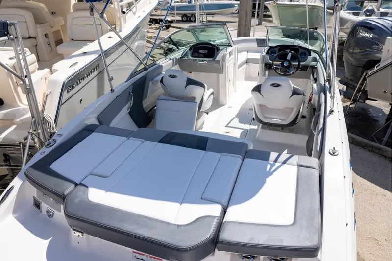 Slide: The Image of 2021 Chaparral 21 SSi OB boat interior with seating and steering wheel. - 4