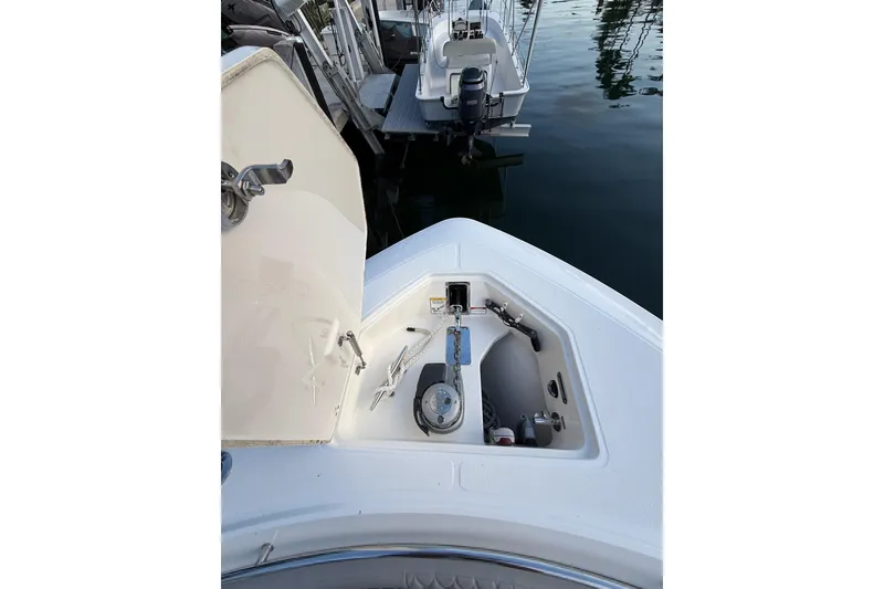 Slide: The Image of 2023 Boston Whaler 380 Outrage anchor compartment, open at dockside. - 14