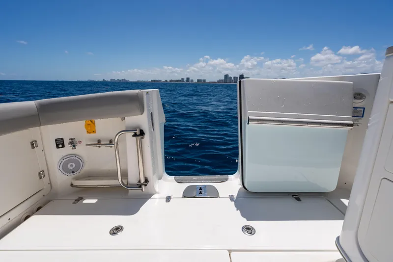 Slide: The Image of 2020 Boston Whaler 380 Outrage boat deck with ocean view and city skyline. - 24