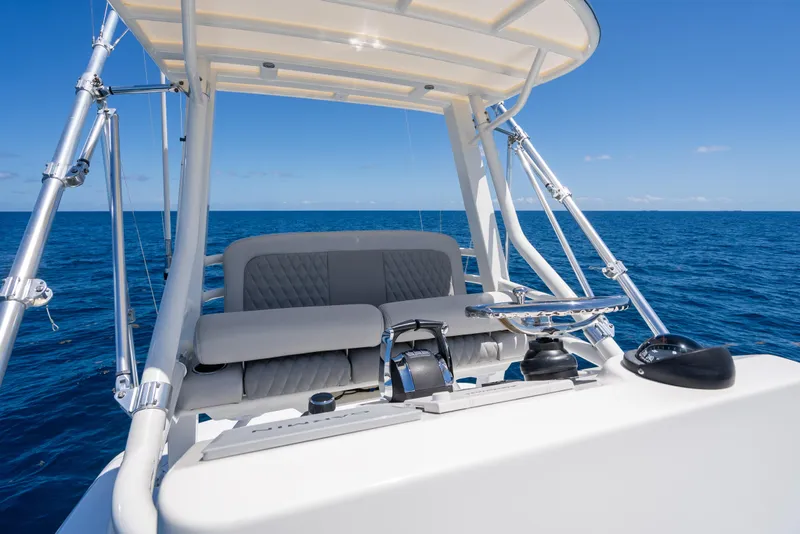 Slide: The Image of Boston Whaler 380 Outrage 2020 helm, ocean backdrop, clear blue sky. - 29