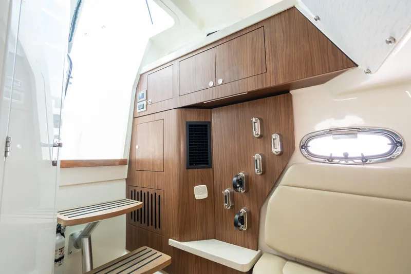 Slide: The Image of Interior of 2020 Boston Whaler 380 Outrage, featuring wood cabinetry and seating. - 35