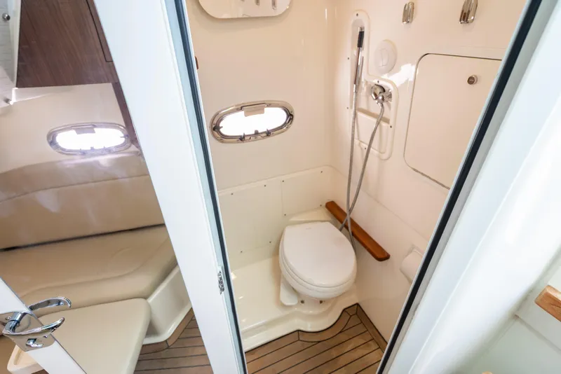 Slide: The Image of 2020 Boston Whaler 380 Outrage boat bathroom with modern fixtures and wooden flooring. - 36