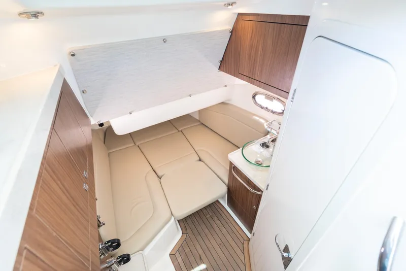 Slide: The Image of Luxurious cabin interior of 2020 Boston Whaler 380 Outrage with wood accents and seating. - 39