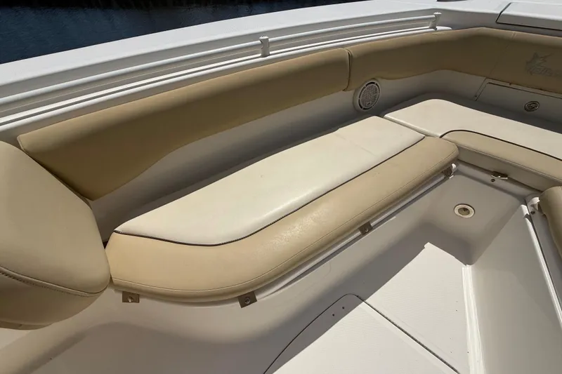 Slide: The Image of 2019 Key West Billistic 281 Center Console boat with beige seating area. - 101