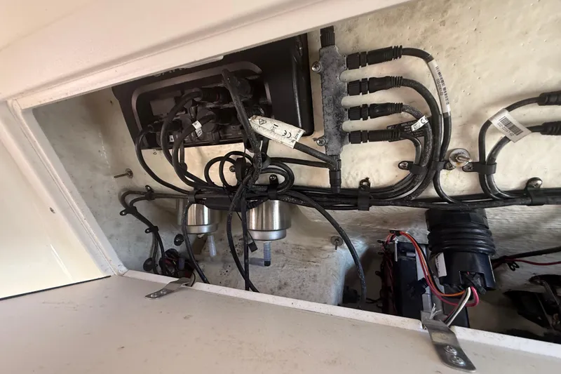 Slide: The Image of 2019 Key West Billistic 281 Center Console wiring and components inside compartment. - 112