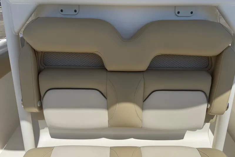 Slide: The Image of 2019 Key West Billistic 281 Center Console, beige and white cushioned seating detail. - 118