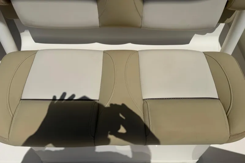 Slide: The Image of 2019 Key West Billistic 281 Center Console seat with beige and white upholstery. - 119