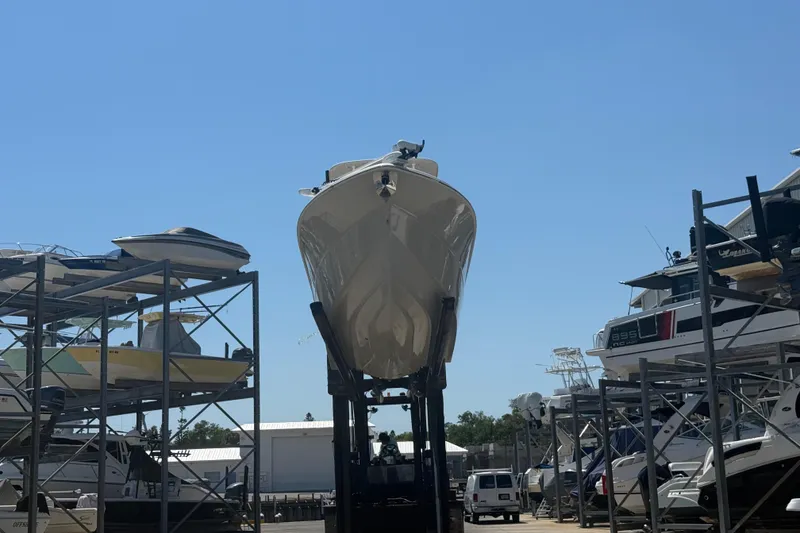 Slide: The Image of 2019 Key West Billistic 281 Center Console boat in dry storage facility. - 12