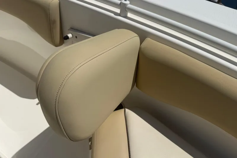 Slide: The Image of 2019 Key West Billistic 281 Center Console boat seating detail, beige upholstery. - 120