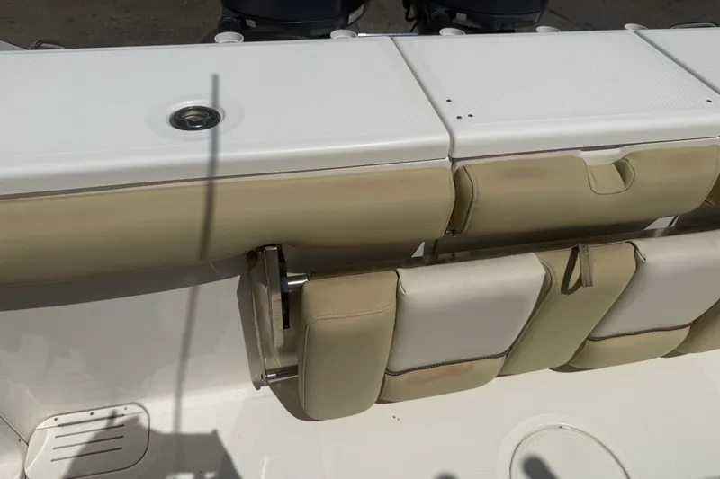 Slide: The Image of 2019 Key West Billistic 281 Center Console boat seating and storage compartments. - 124