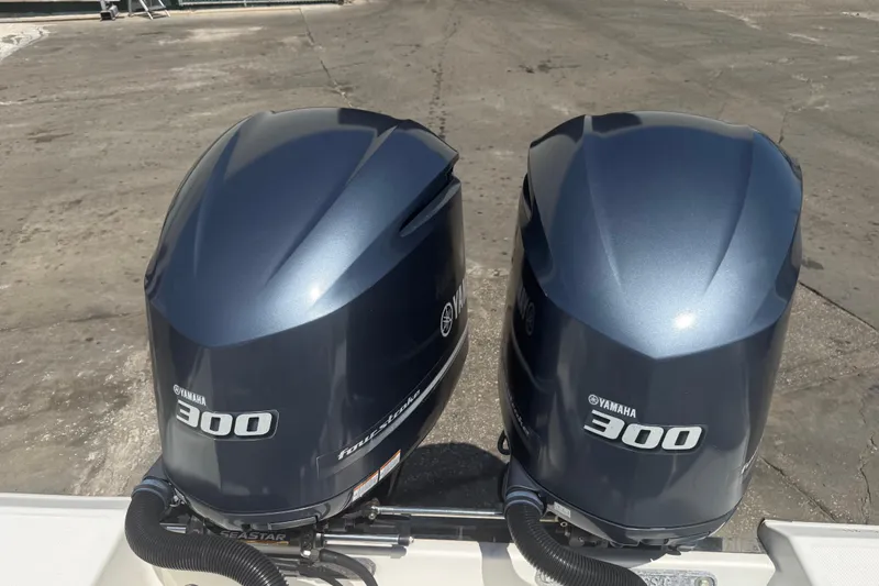 Slide: The Image of Twin Yamaha 300 outboard engines on a 2019 Key West Billistic 281 Center Console boat. - 126