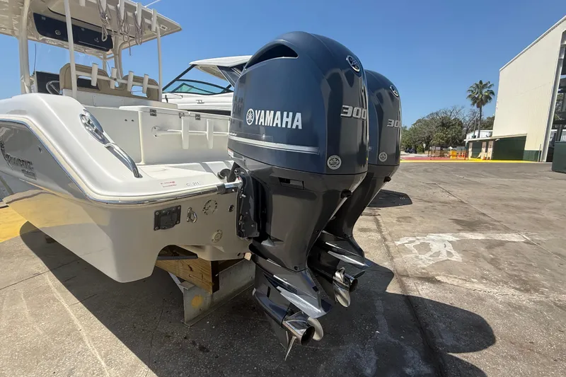 Slide: The Image of 2019 Key West Billistic 281 Center Console with dual Yamaha 300 engines, docked outdoors. - 14