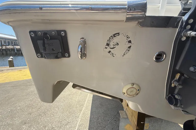 Slide: The Image of 2019 Key West Billistic 281 Center Console boat stern with dockside view. - 15