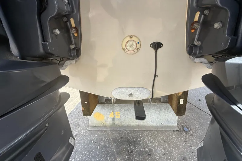 Slide: The Image of 2019 Key West Billistic 281 Center Console boat stern with dual outboard motors. - 16