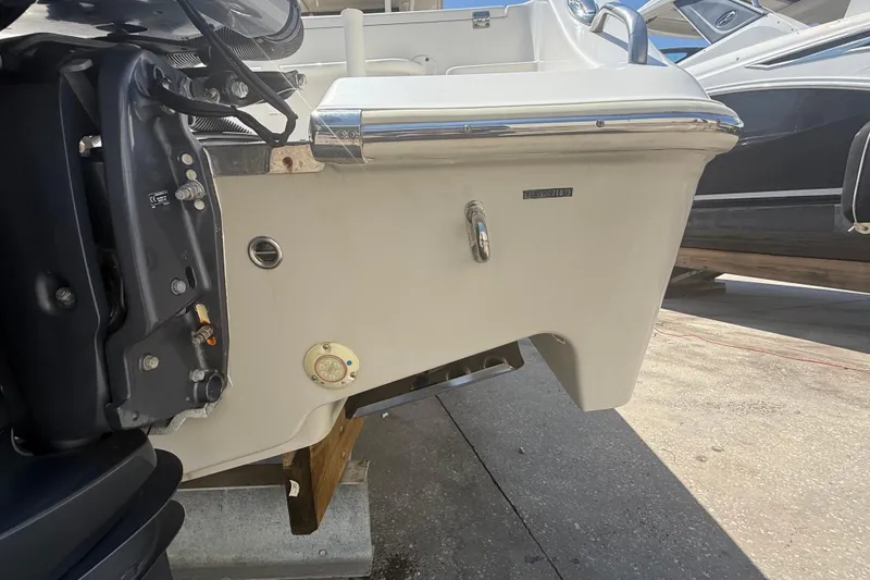 Slide: The Image of 2019 Key West Billistic 281 Center Console boat stern view with motor details. - 17