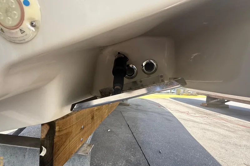 Slide: The Image of 2019 Key West Billistic 281 Center Console boat hull detail with fittings and trim tab. - 18