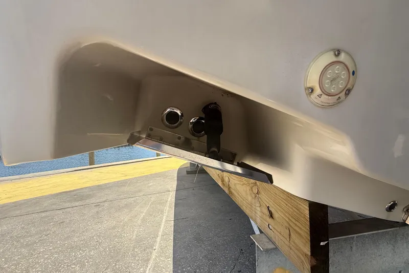 Slide: The Image of 2019 Key West Billistic 281 Center Console boat hull detail with fittings and light. - 19