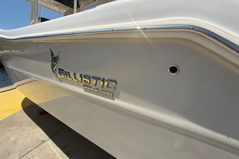 Slide: The Image of 2019 Key West Billistic 281 Center Console boat side view with logo. - 21