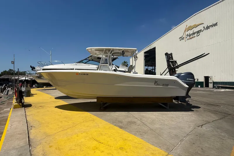 Slide: The Image of 2019 Key West Billistic 281 Center Console boat at marina dockside. - 23
