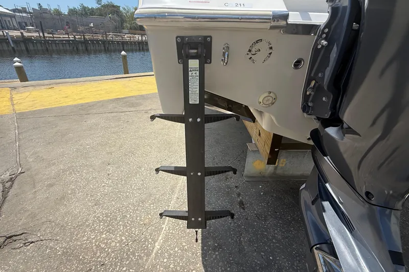 Slide: The Image of 2019 Key West Billistic 281 Center Console boat ladder at dockside. - 24