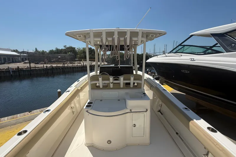 Slide: The Image of 2019 Key West Billistic 281 Center Console boat docked near water. - 25