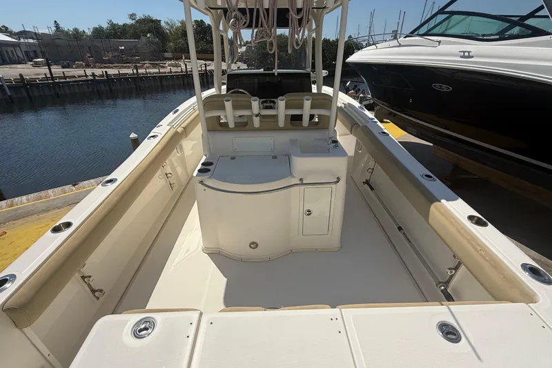 Slide: The Image of 2019 Key West Billistic 281 Center Console boat interior at dockside. - 26