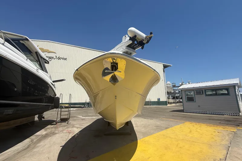 Slide: The Image of 2019 Key West Billistic 281 Center Console boat at marina, sunny day. - 3