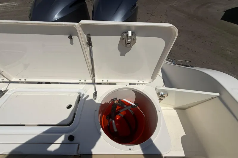Slide: The Image of Open storage compartment on 2019 Key West Billistic 281 Center Console boat. - 35