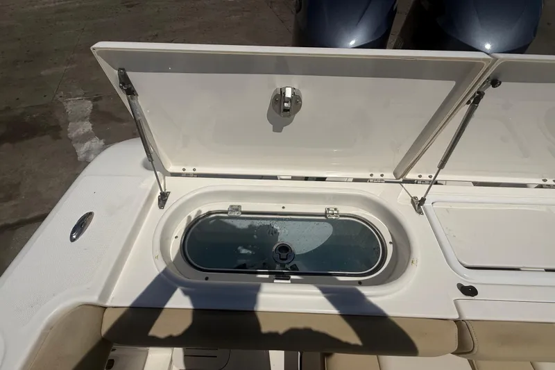 Slide: The Image of 2019 Key West Billistic 281 Center Console livewell with open lid, showcasing interior features. - 37