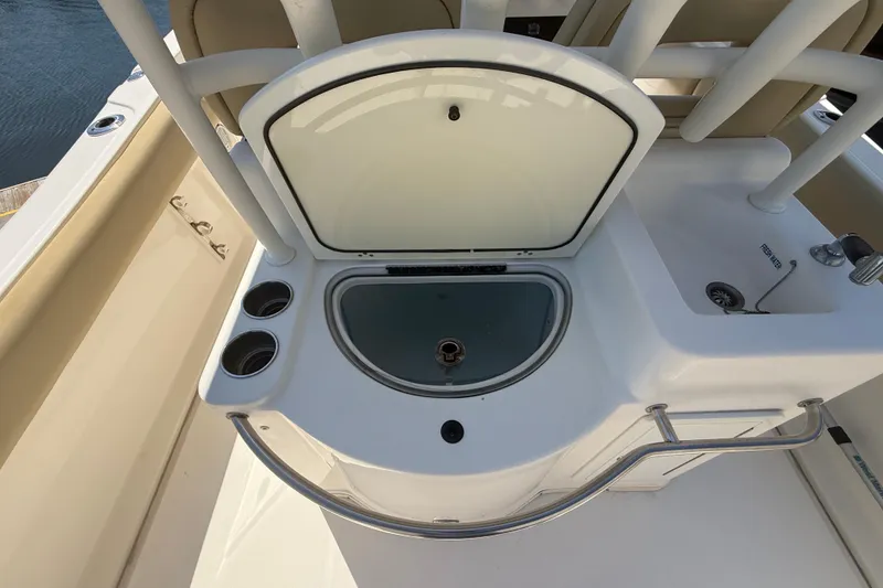 Slide: The Image of 2019 Key West Billistic 281 Center Console boat with open storage compartment. - 39