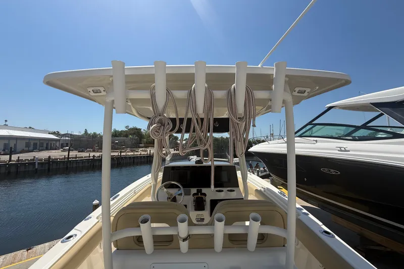 Slide: The Image of 2019 Key West Billistic 281 Center Console boat docked at marina, sunny day. - 40