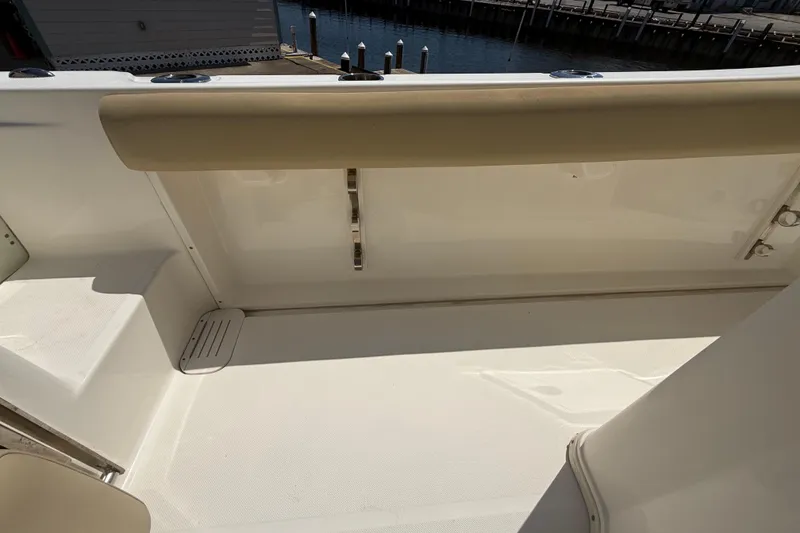Slide: The Image of 2019 Key West Billistic 281 Center Console interior with beige seating and white deck. - 41