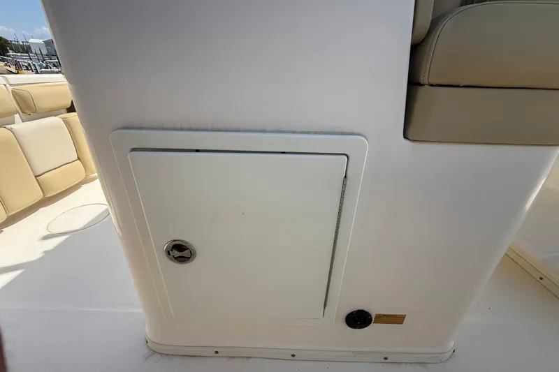 Slide: The Image of 2019 Key West Billistic 281 Center Console interior with storage compartment. - 46