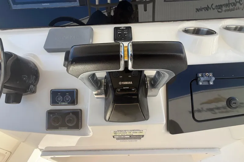 Slide: The Image of Control panel of 2019 Key West Billistic 281 Center Console with Yamaha throttle. - 57
