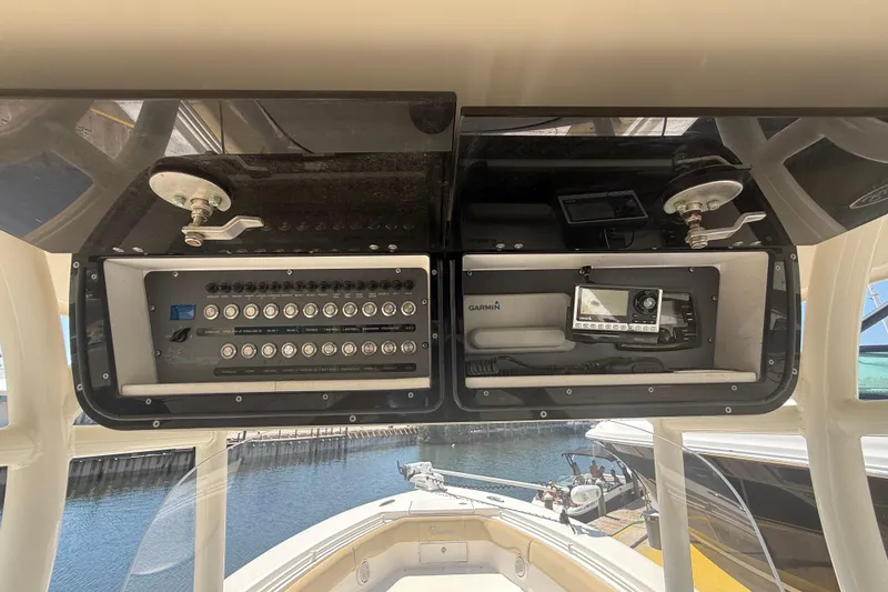 Slide: The Image of 2019 Key West Billistic 281 Center Console dashboard with control panel and Garmin device. - 58