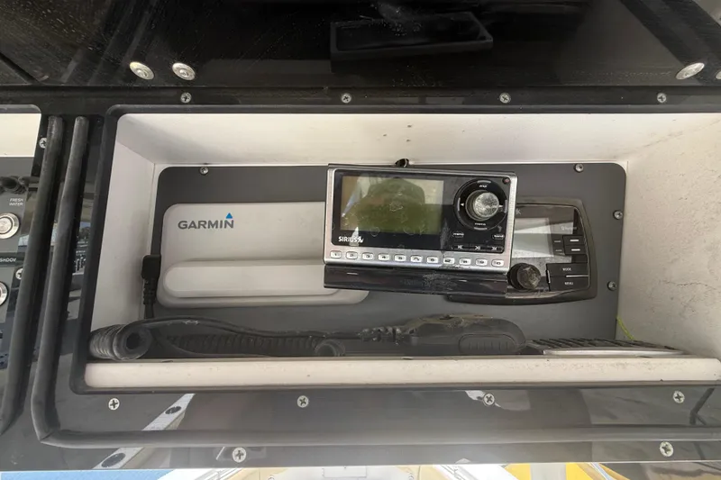 Slide: The Image of 2019 Key West Billistic 281 Center Console dashboard with Garmin and SiriusXM equipment. - 60