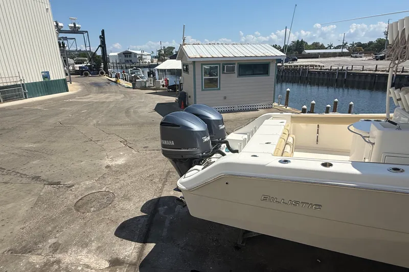 Slide: The Image of 2019 Key West Billistic 281 Center Console boat with Yamaha engines at a dock. - 8