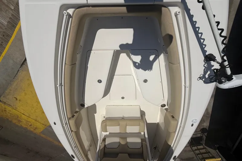 Slide: The Image of 2019 Key West Billistic 281 Center Console boat interior, featuring spacious seating and storage. - 84