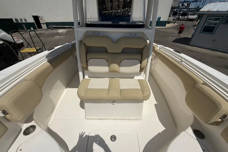 Slide: The Image of 2019 Key West Billistic 281 Center Console boat interior with beige seating. - 87