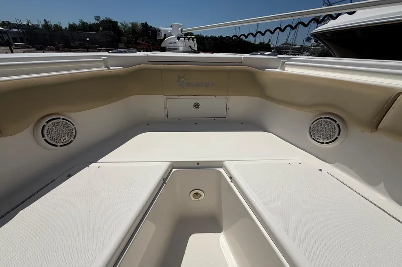 Slide: The Image of 2019 Key West Billistic 281 Center Console boat interior with seating and speakers. - 93